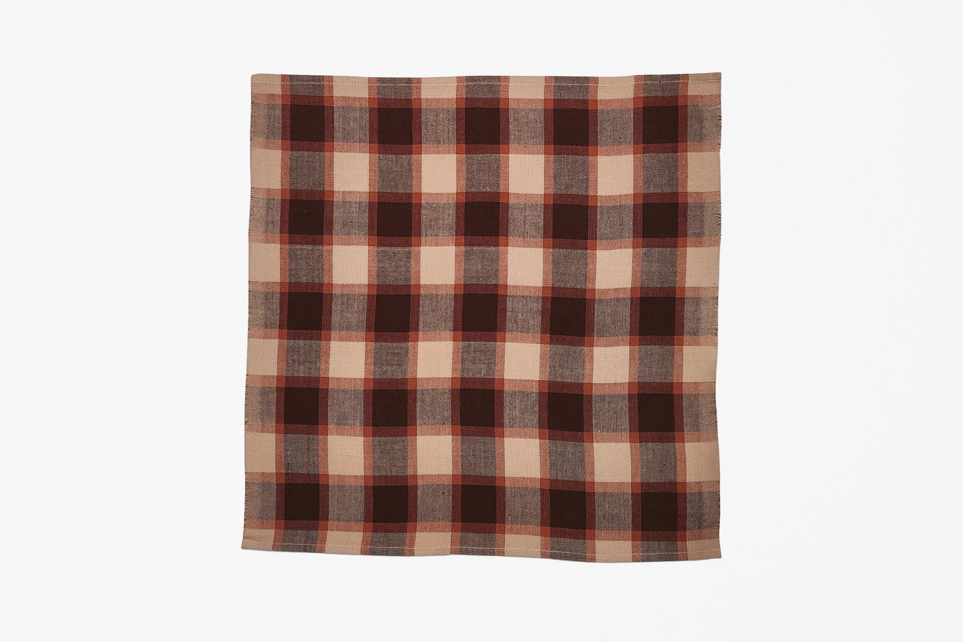 A square woven plaid napkin with a classic plaid pattern in dark brown, rust orange, and beige, displayed flat against a clean white background.