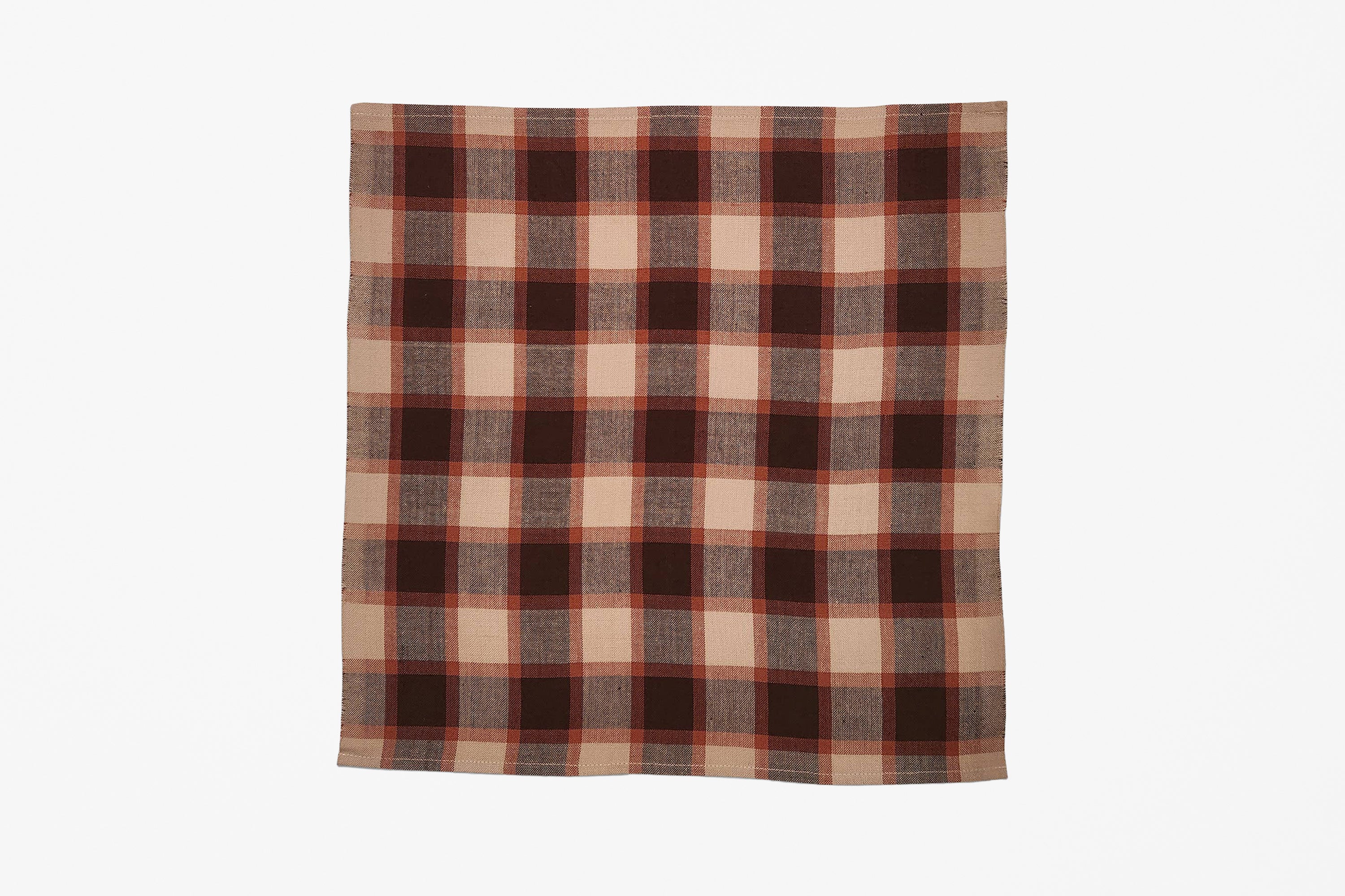 A square woven plaid napkin with a classic plaid pattern in dark brown, rust orange, and beige, displayed flat against a clean white background.