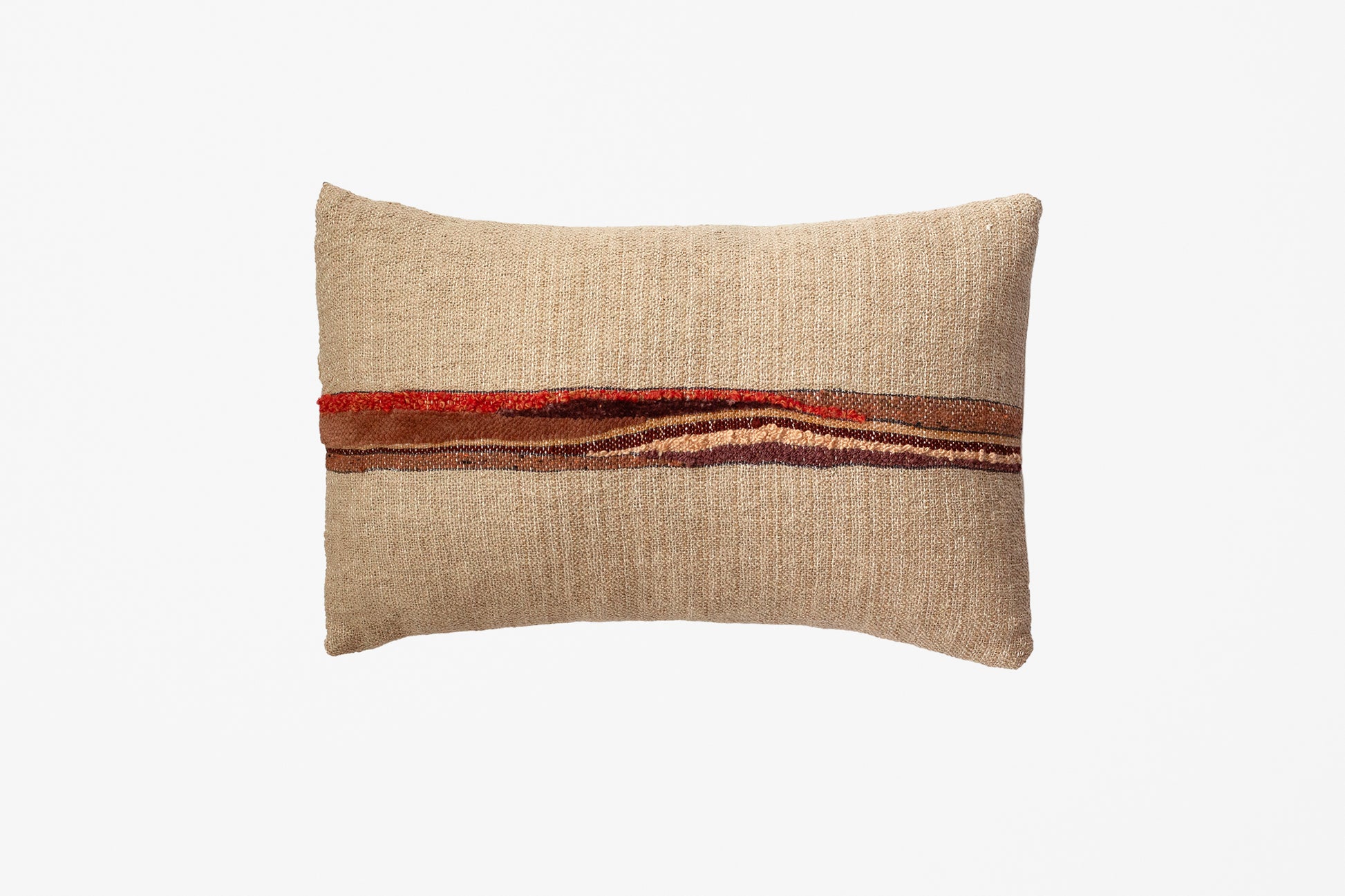 A rectangular beige textured throw pillow with a horizontal band of rust red, orange, and brown stripes across the center, shown on a plain white background.