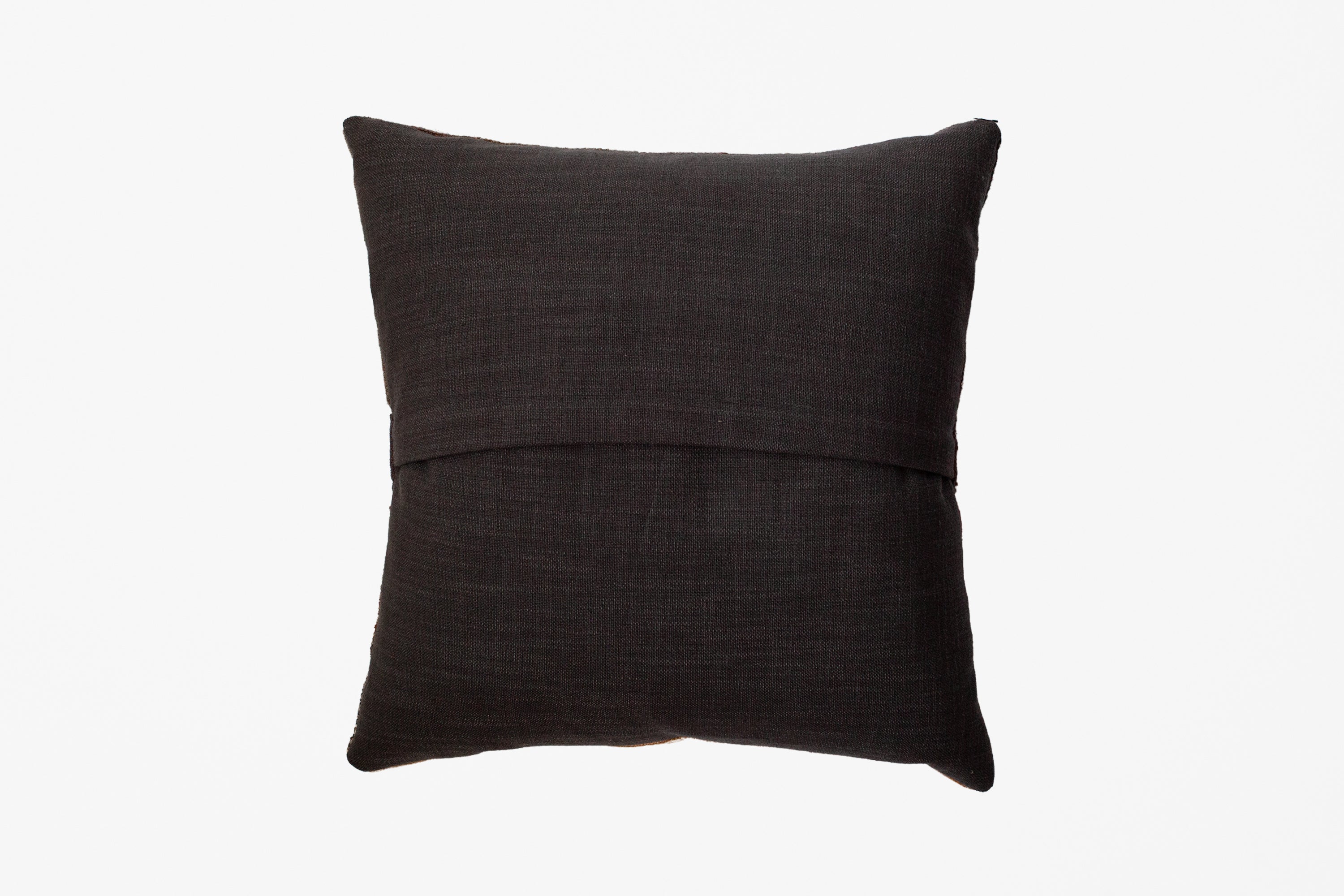 A textured linen backing of a square dark brown pillow with a horizontal stitched seam across the middle, shown against a plain white background.