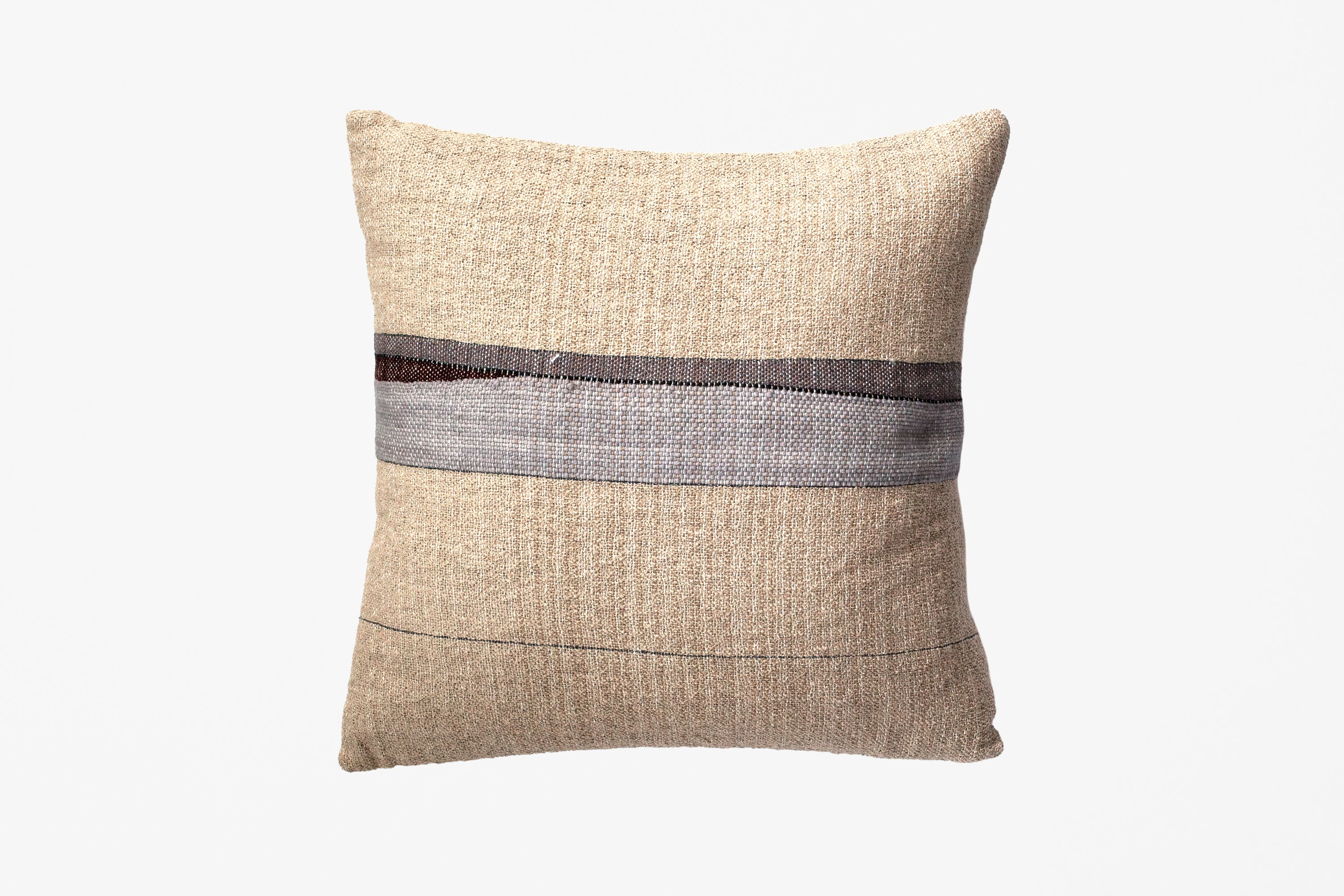 A square beige textured throw pillow with a horizontal striped pattern in gray, brown, and black across the center, shown against a plain white background.