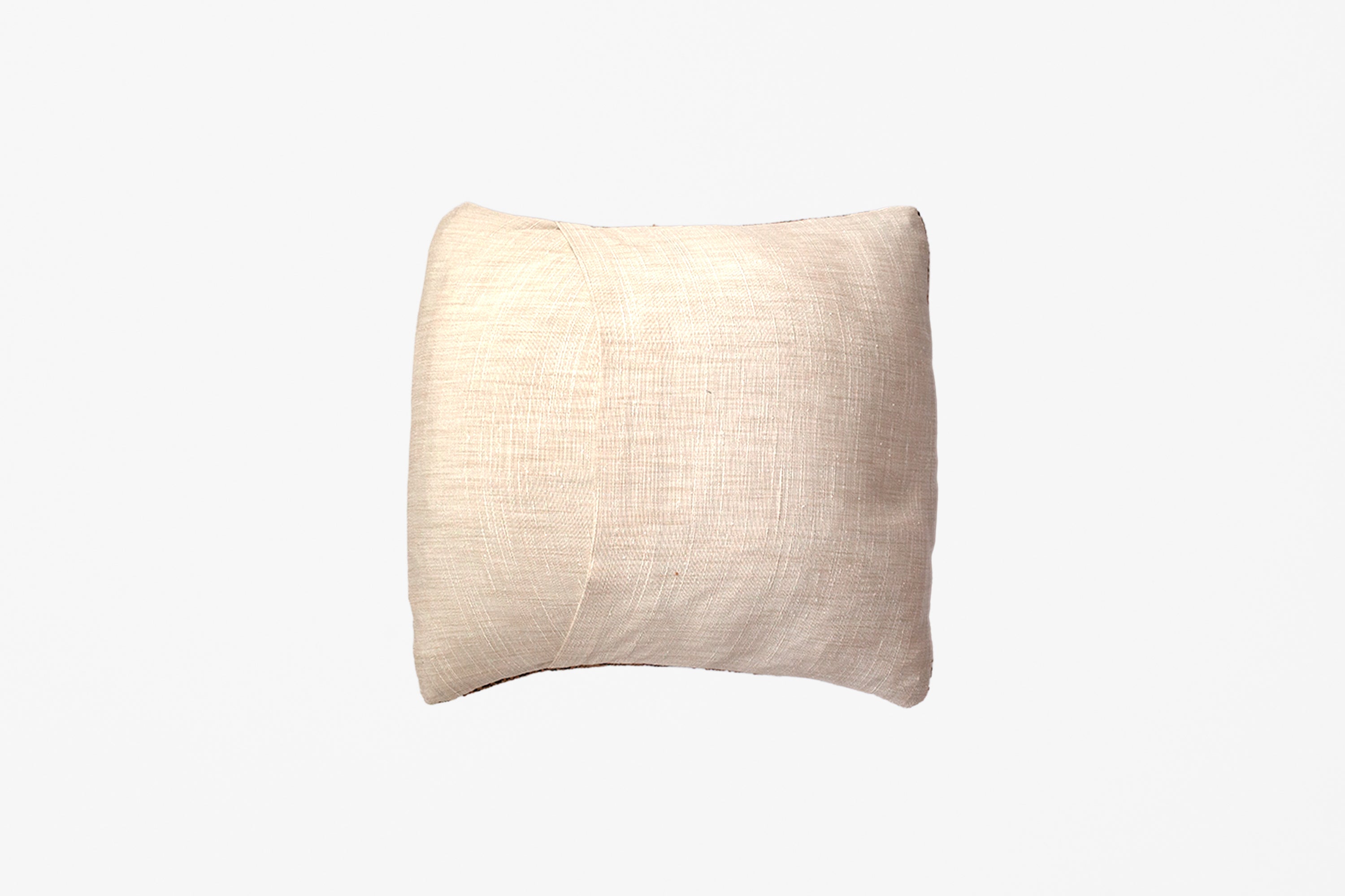 The linen backing of an extra small handwoven tapestry pillow against a white background.