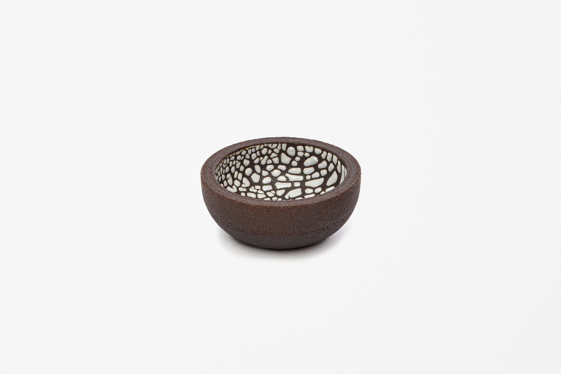 A small handmade ceramic bowl with a dark brown textured exterior and a white crackle glazed interior, shown on a plain white background.